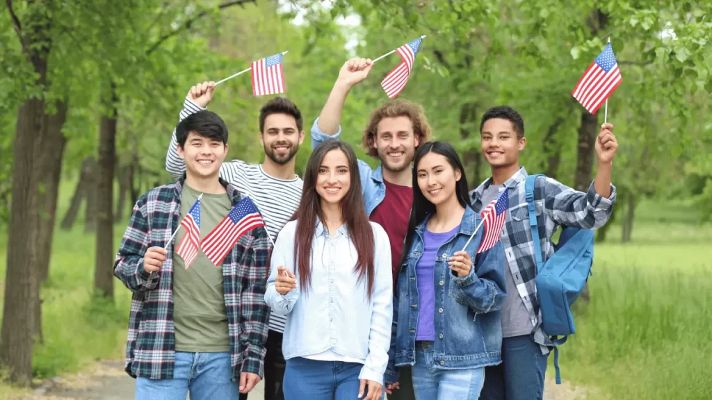 students waving USA flags