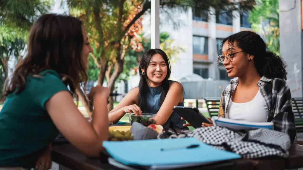 Students talking to each other over health insurance