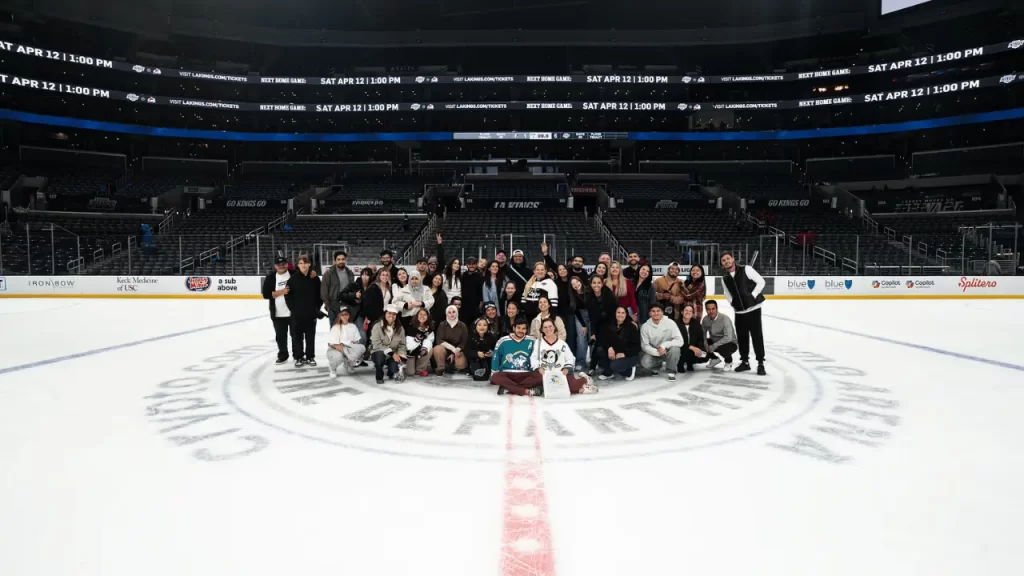 LSI students posing for a photo inside the rink - img la kings game lsi - Language Systems International LSI students posing for a photo inside the rink