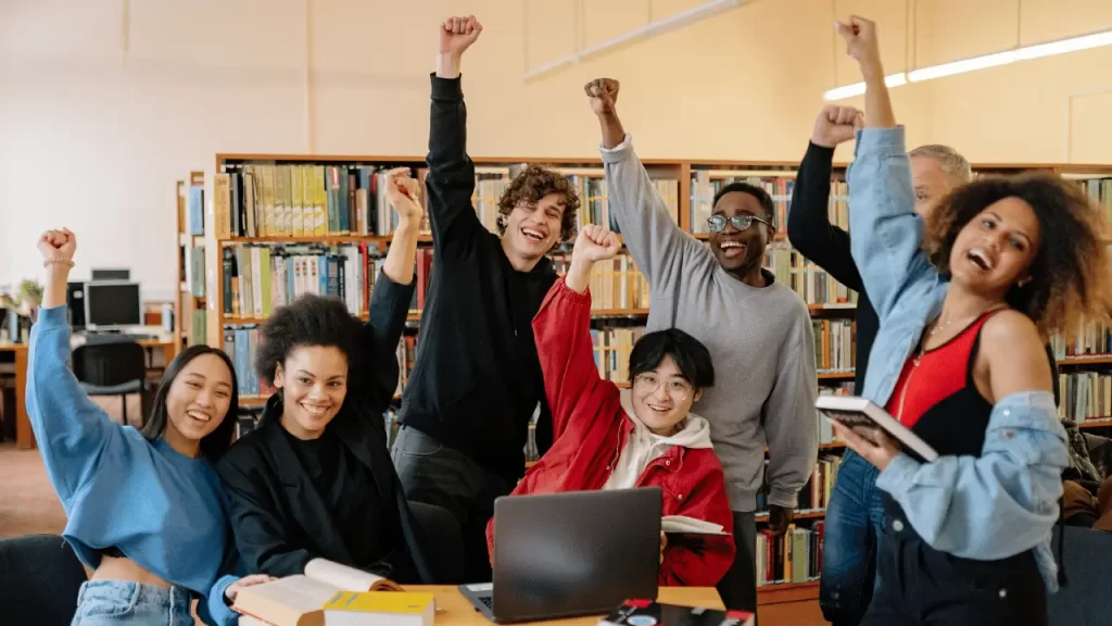 group of cheering students - img old sayings lsi - Language Systems International group of cheering students