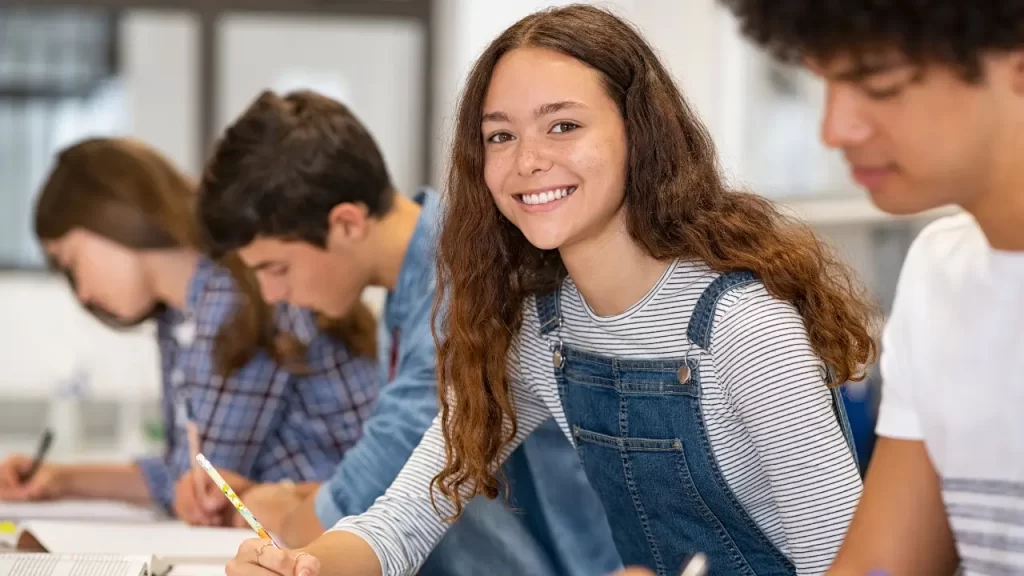 The image shows a girl studying English