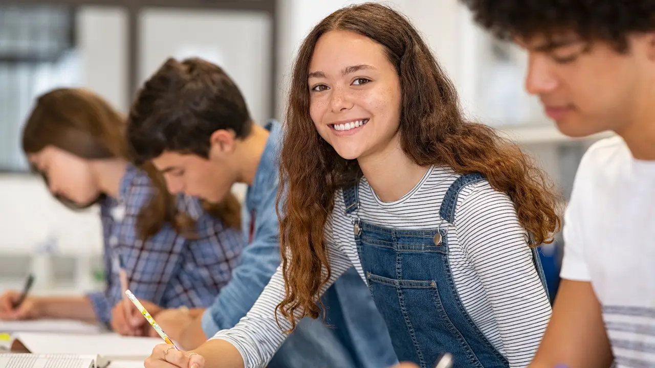 The image shows a girl studying English
