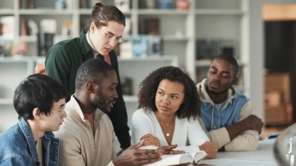 Students talking to each about adverbs of frequency. - img adverbs of frequency lsi - Language Systems International Students talking to each about adverbs of frequency.