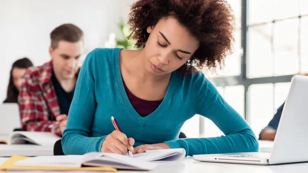 Woman writing an essay